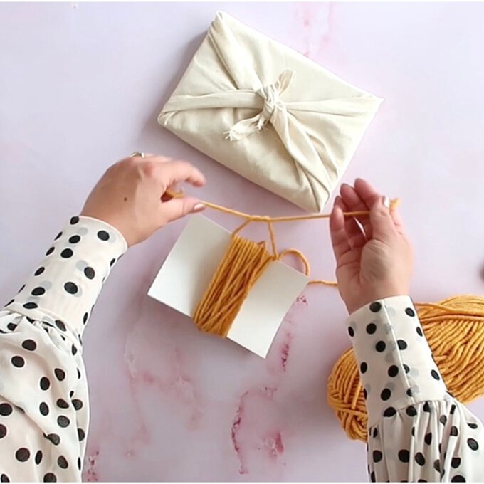 How to Gift Wrap with Yarn Scraps | Hobbycraft